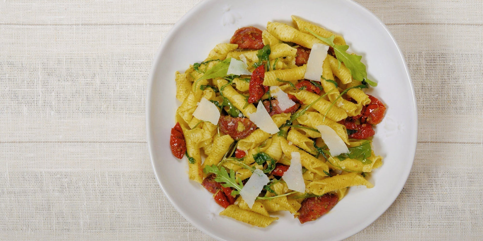 Pesto Garganelli with Grilled Chorizo, Rocket, and Sun-Dried Tomatoes